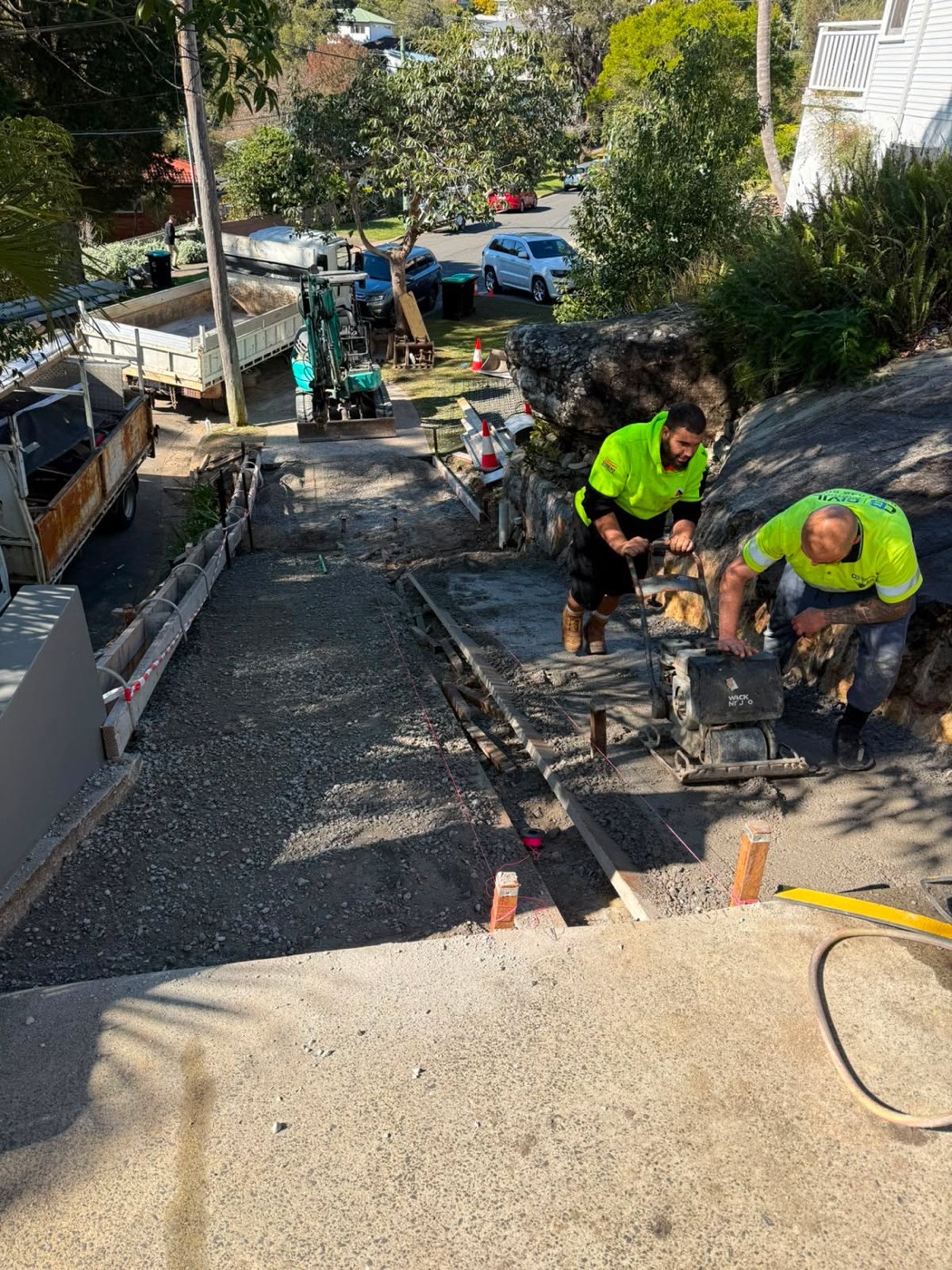 Compacting the base on a steep driveway