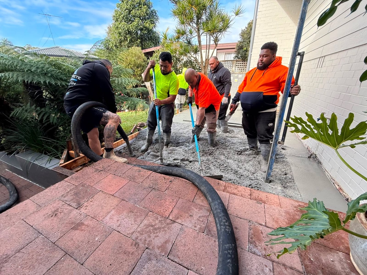 The crew placing concrete for a new slab