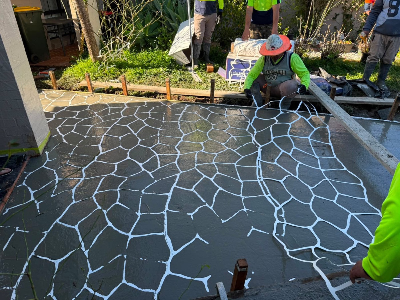 Civil Brothers crew laying a stencilled pattern on fresh concrete