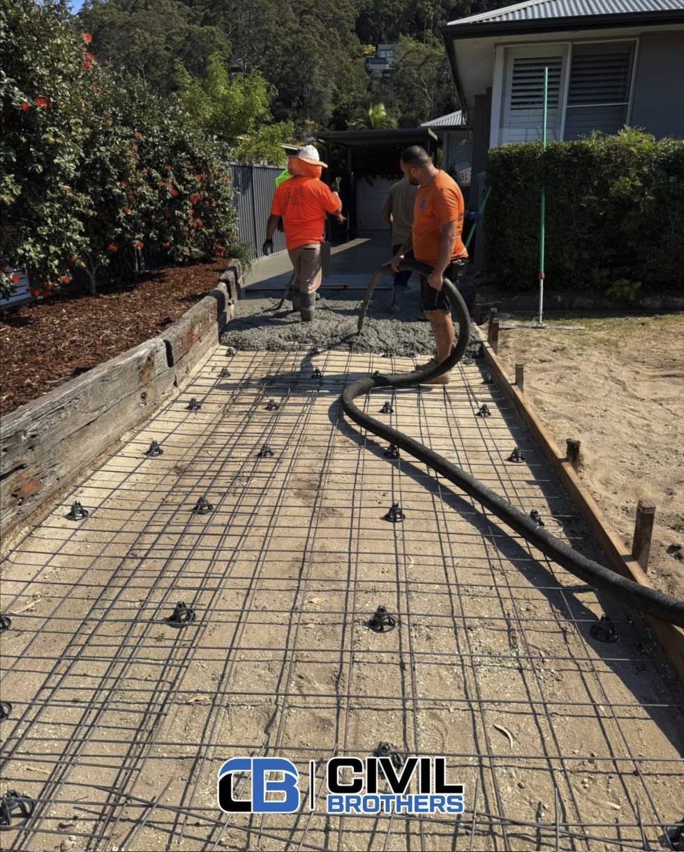 Civil Brothers crew pumping concrete over reinforcement mesh