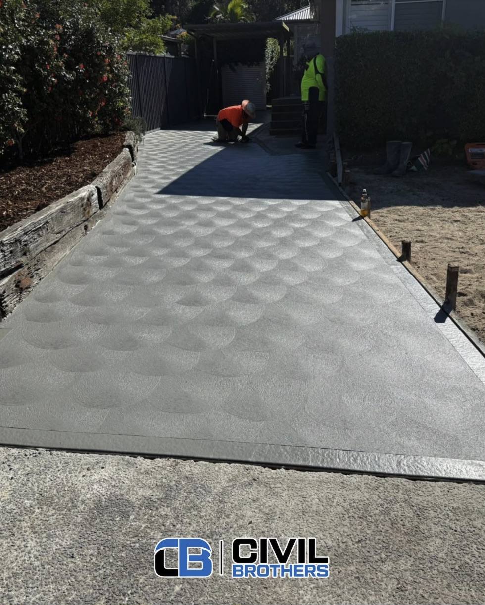 Fan-finished concrete driveway by Civil Brothers