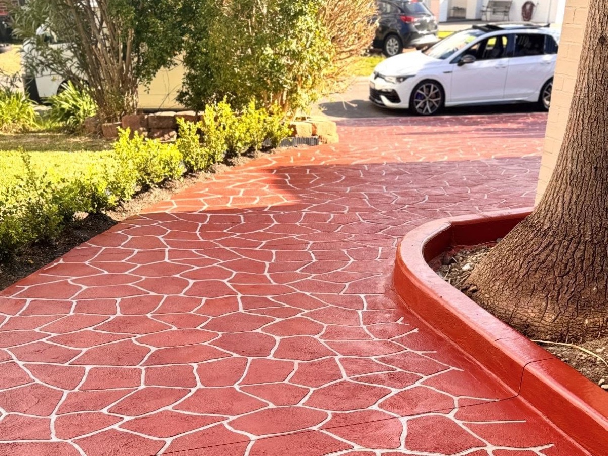 Red stamped concrete driveway by Civil Brothers